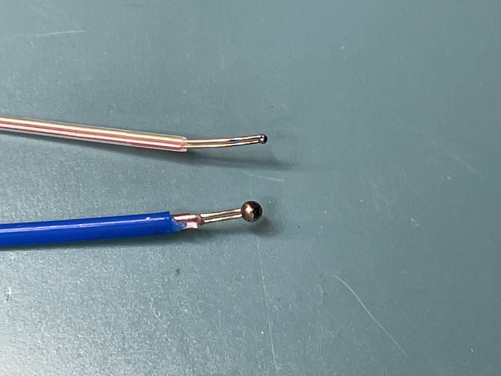 Two different thermocouples, zoomed in on the welded point