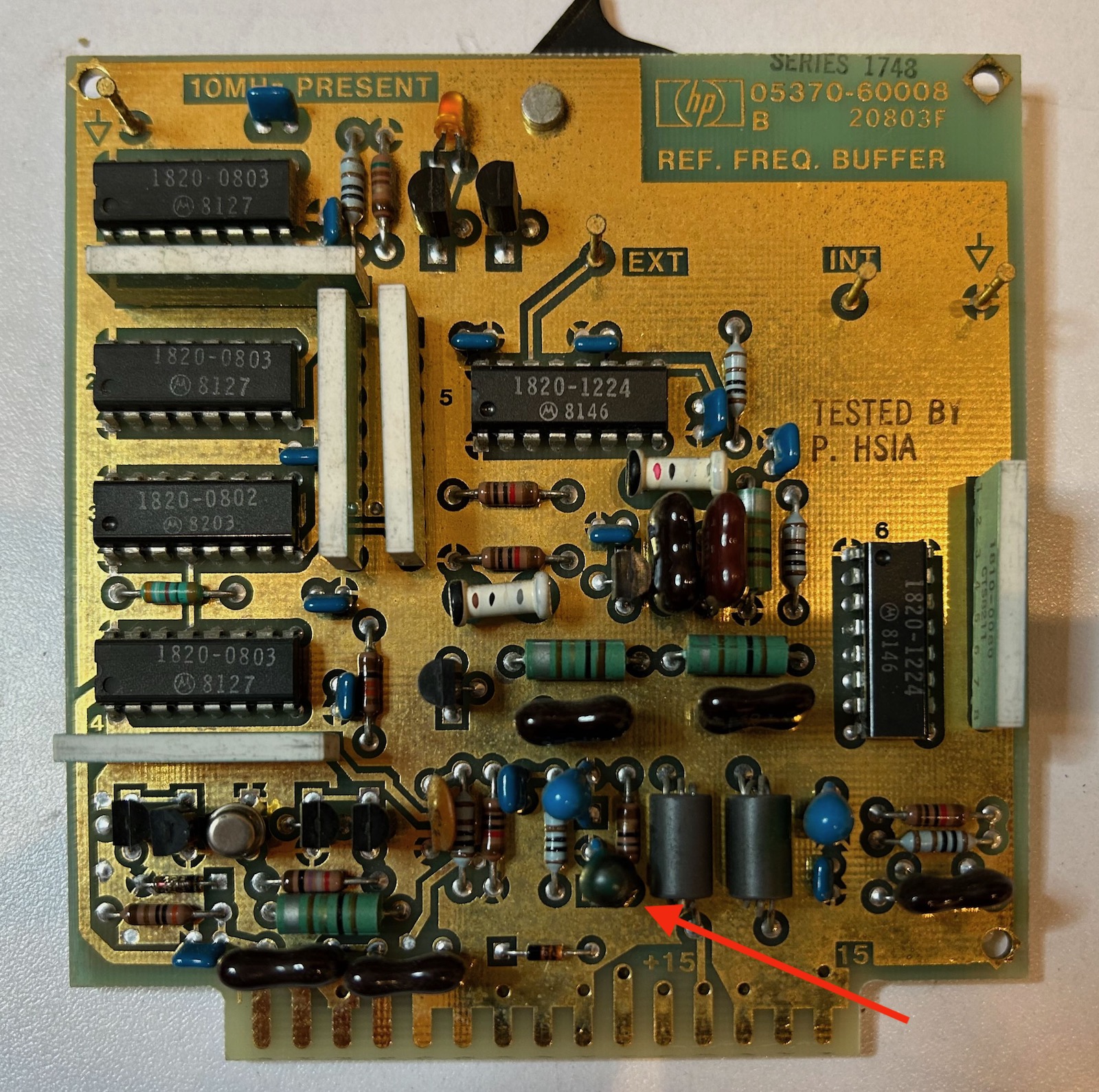 Black capacitor on reference frequency buffer PCB
